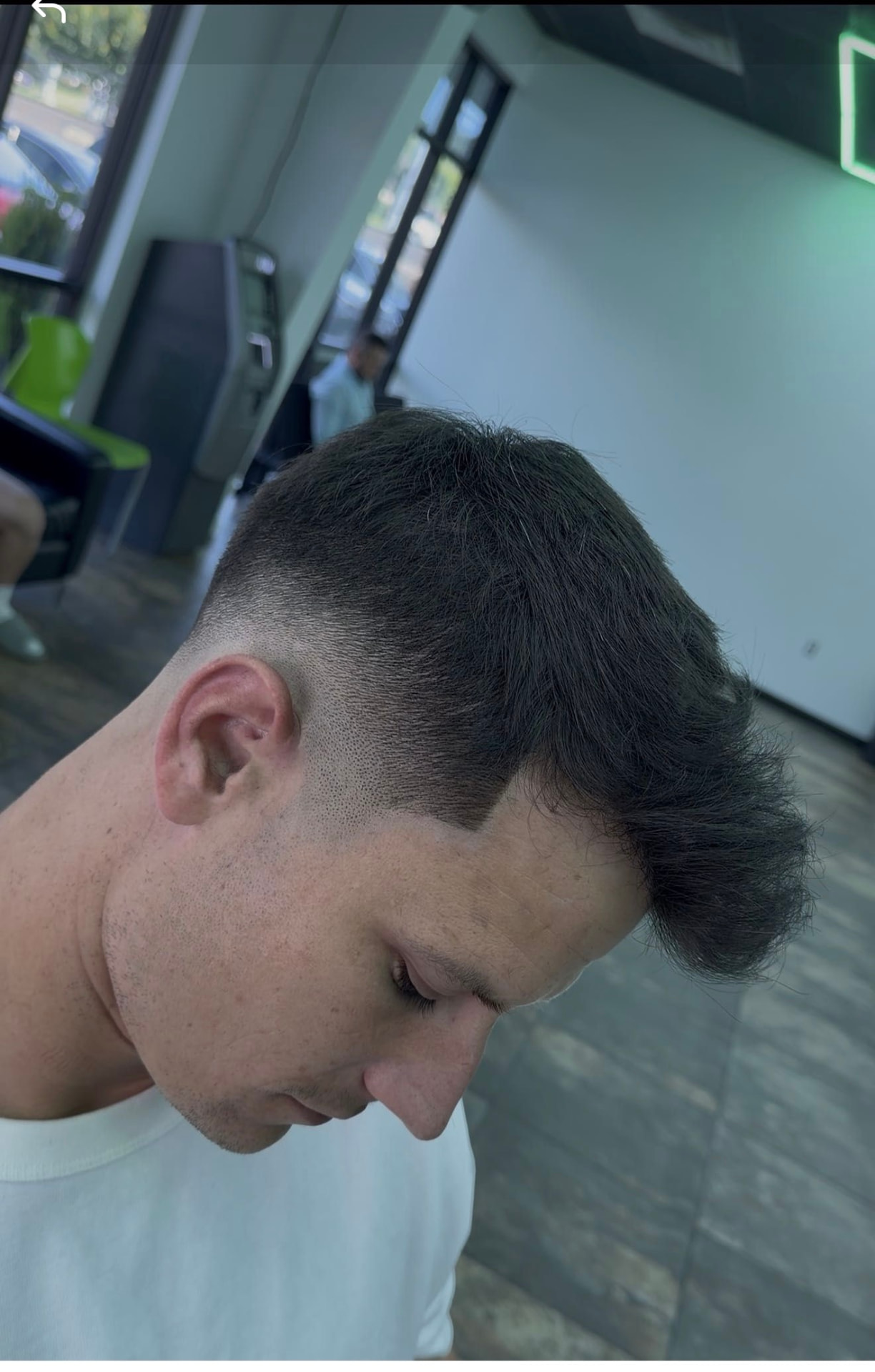 Client with a textured mullet and skin fade